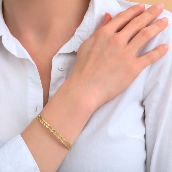 Bracelet fantaisie double rangs gris avec bijoux dorés